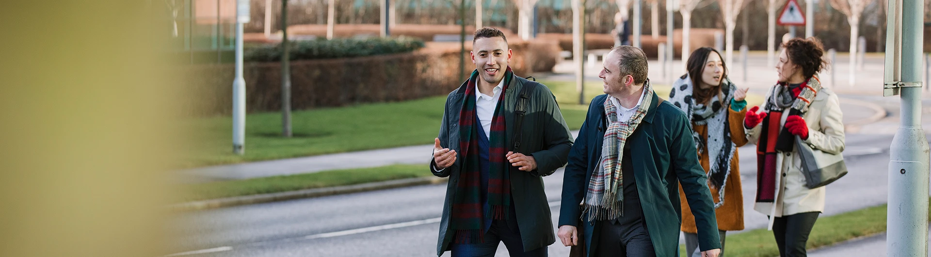 People walking and talking together, reflecting active participation and engagement. (photo)